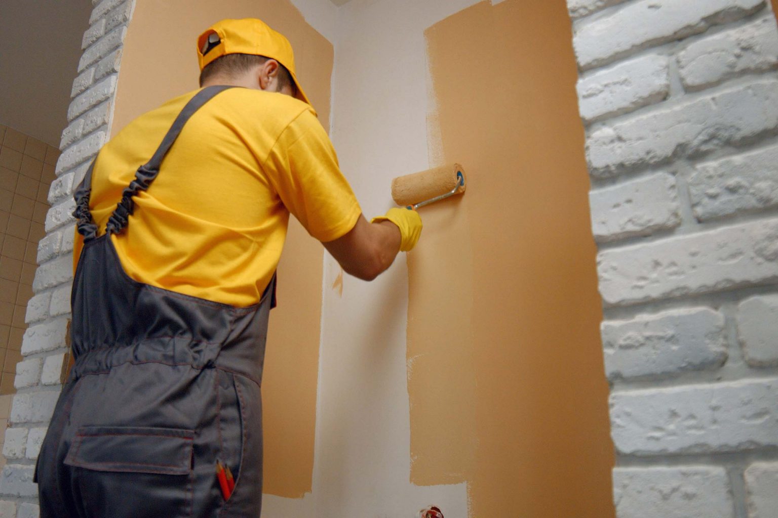 Expert working on marble wall surface